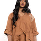 Woman wearing a brown outfit with a white background