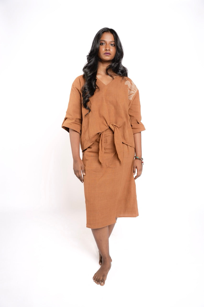 Woman wearing a brown outfit on a white background