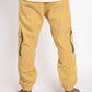 Person wearing mustard yellow cargo pants and a white shirt on a white background