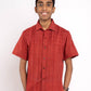 Person wearing a red shirt and orange shorts on a white background