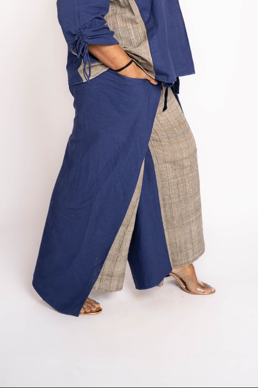 Woman wearing a blue and gray outfit on a white background