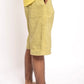 Person wearing yellow shorts on a white background