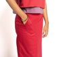 Person wearing a red outfit with a white background