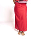 Person wearing a red skirt and top on a white background