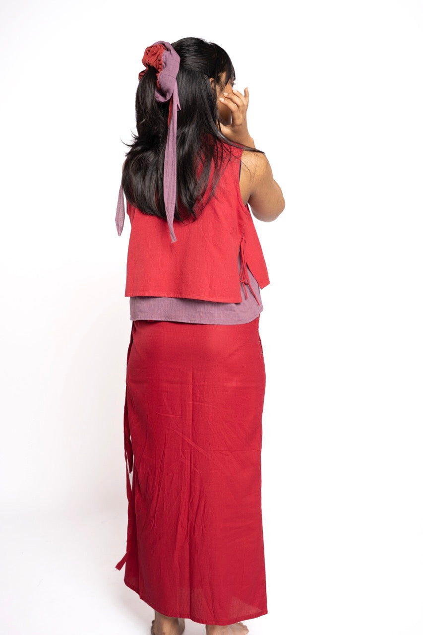 Woman wearing a red outfit with a white background