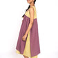 Woman wearing a two-tone dress with purple and yellow on a white background