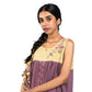 Woman wearing a traditional outfit with a purple and yellow dress on a white background